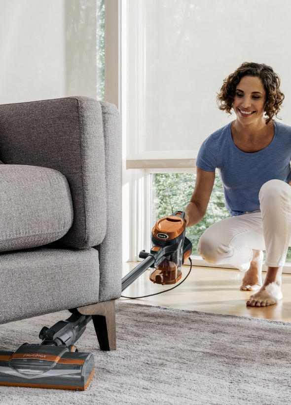 Vacuuming under the sofa