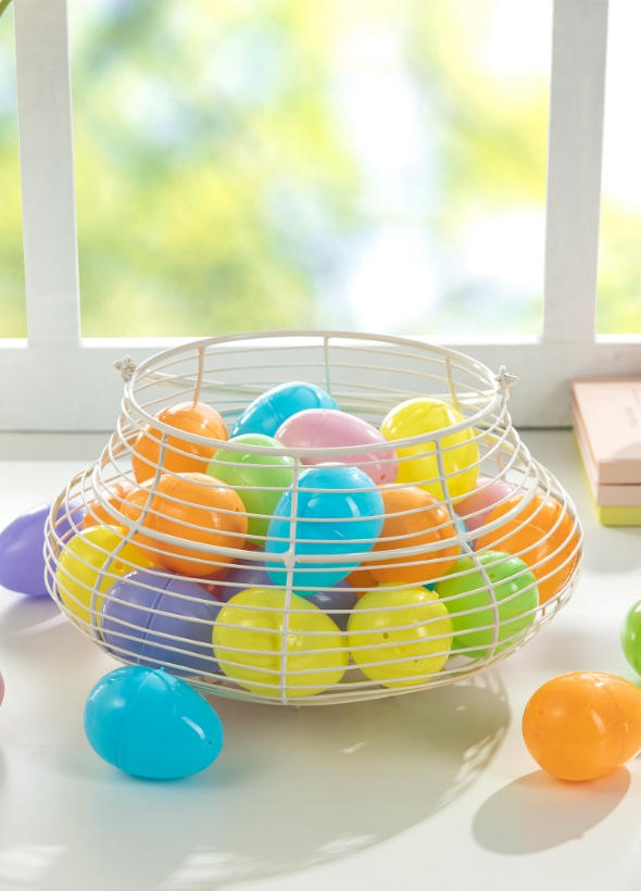 Metal wire basket filled with Easter eggs