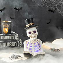 Glitzhome 10.25in. H Halloween Lighted Resin Skull Book Table Decor